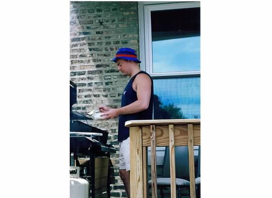 the charming Buckeye grilling on the deck of his Sheffield apartment